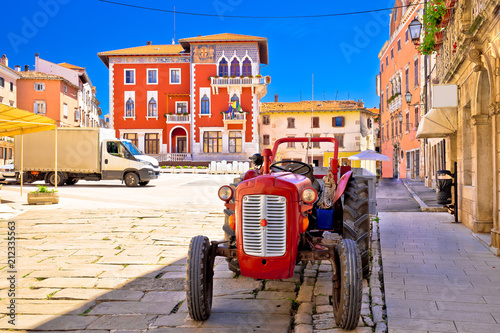 Town of Vodnjan colorful square and old tractor view