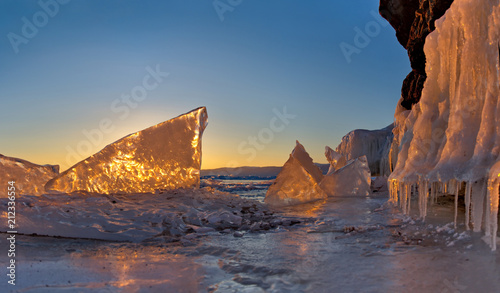 Russia. The sunset and the ice of lake Baikal