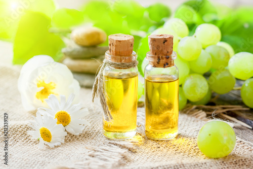 Vegetable grape seed oil on a wooden table