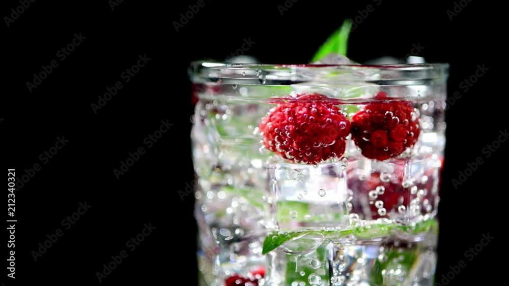 cold drink with blackberries and mint on a black background closeup cold drink with blackberries and mint on a black background closeup