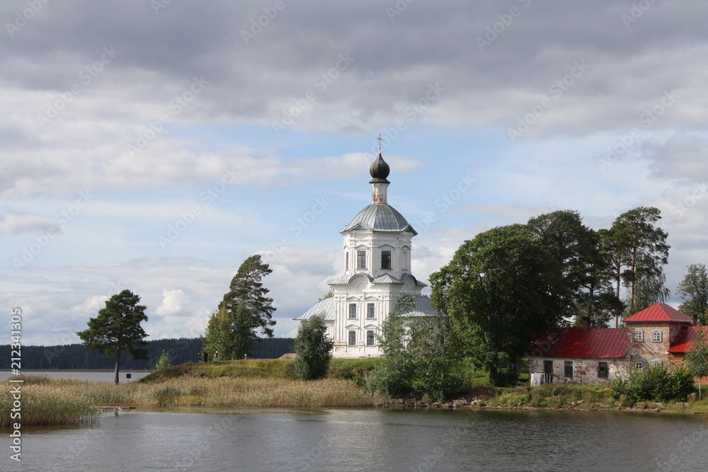 Stolobny island, Nilov Monastery, Seliger lake in Russia seen from the lake, churches, clouds