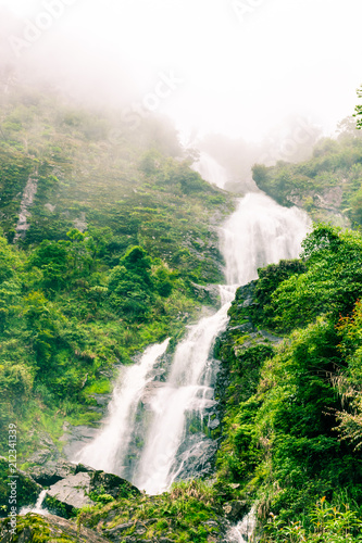 thac bac (silver waterfall) in rainy day at sapa,vietnam photo