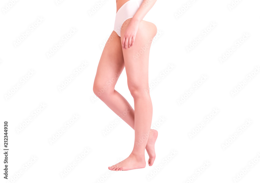 Side view of a beautiful naked legs of a woman walking isolated on a white background Side view of a beautiful naked legs of a woman walking isolated on a white background