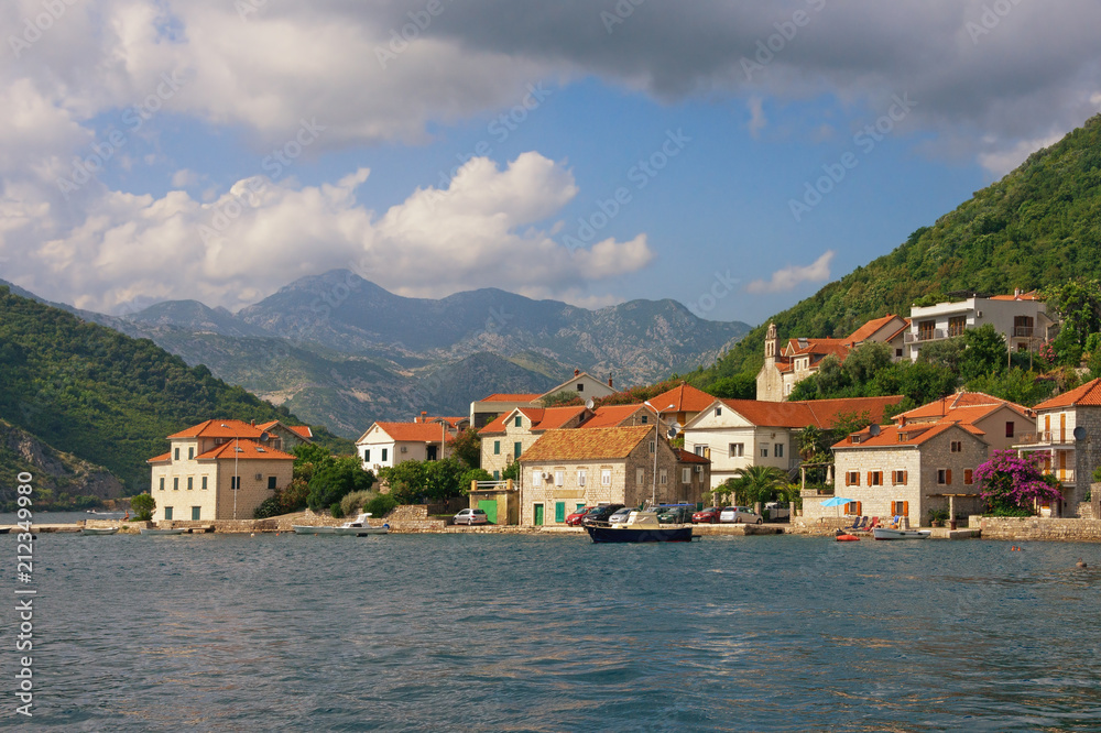 Beautiful Mediterranean landscape with small seaside village. Montenegro, Bay of Kotor, Lepetane village
