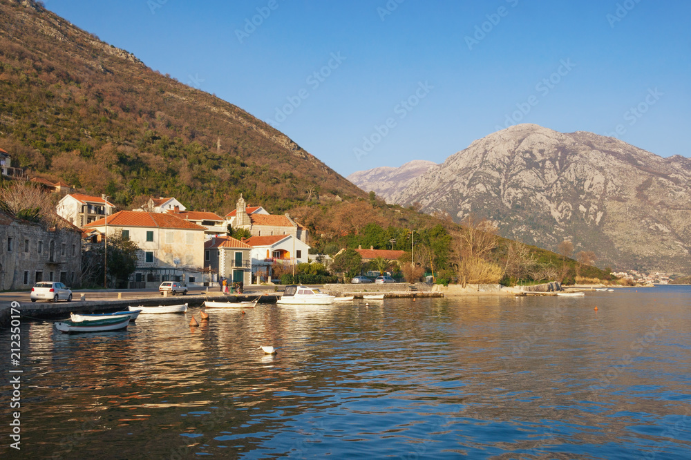 Sunny Mediterranean landscape in winter. Montenegro, Bay of Kotor, view of small town of Kamenari