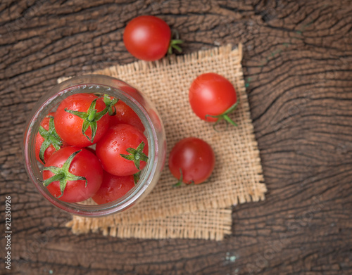 Mini tomatoes cherry tomatoes on wood