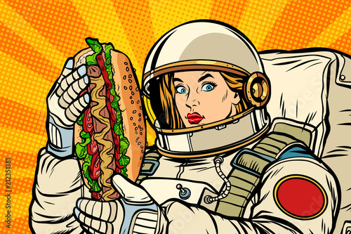 Hungry woman astronaut with hot dog