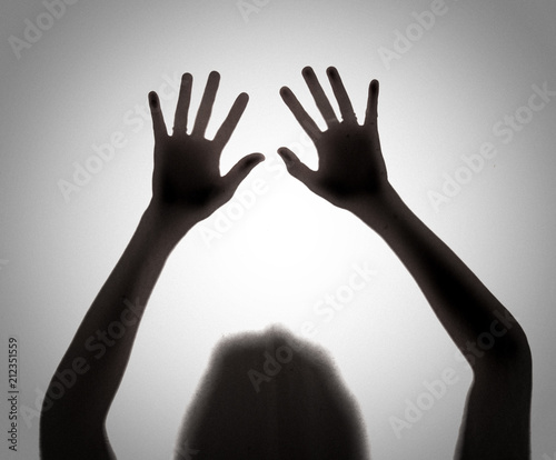 Silhouette of shadow of hands behind,blur image