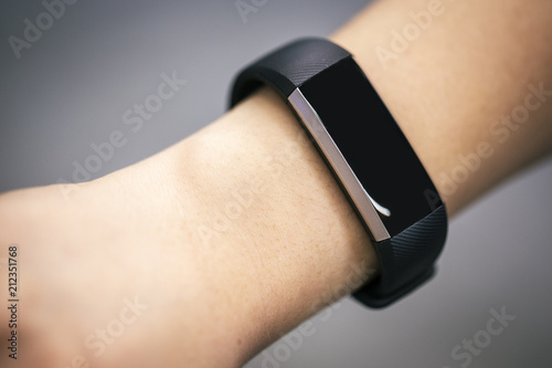 Fitness Activity Tracker With Heartbeat Rate on Woman's Hand 