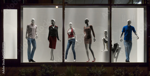 Mannequins in fashion shop, display window, interior design photo