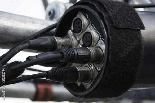 A panel of XLR outlet connectors. The XLR connector is a style of electrical connector, primarily found on professional audio, video, and stage lighting equipment.