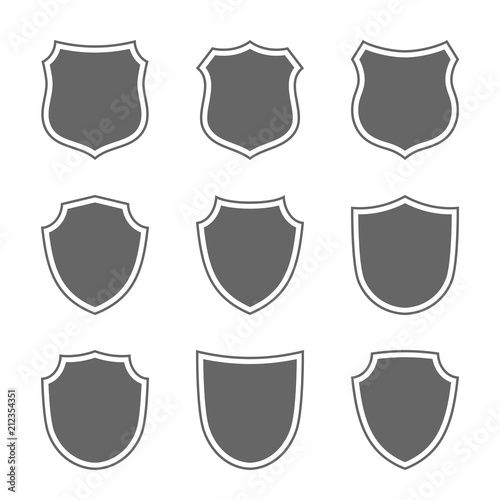 Shield shape icons set. Gray label signs isolated on white. Symbol of protection, arms, coat honor, security, safety. Flat retro style design. Element vintage heraldic emblem. Vector illustration