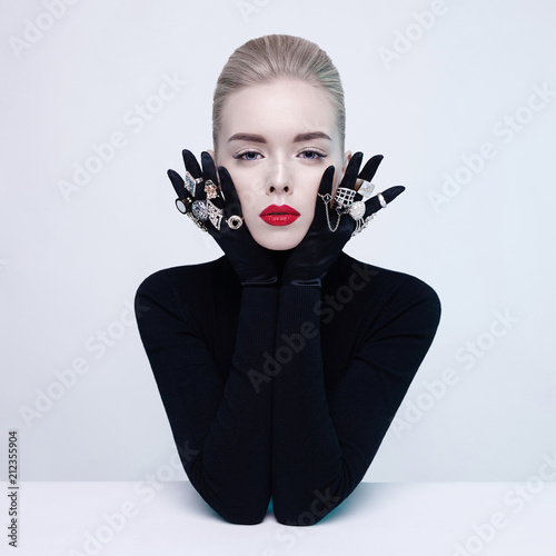 Beautiful blonde lady with lot of precious rings