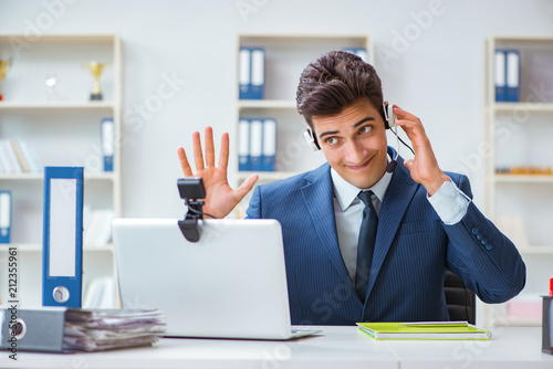 Young help desk operator working in office