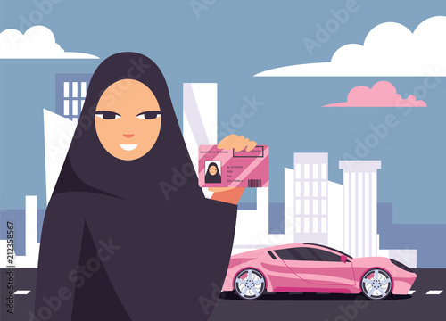 Lovely arab woman in hijab holding her driving licence