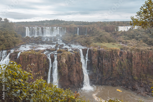 The Igua  u Falls is a group of about 275 waterfalls on the Igua  u River in Brazil and Argentina.