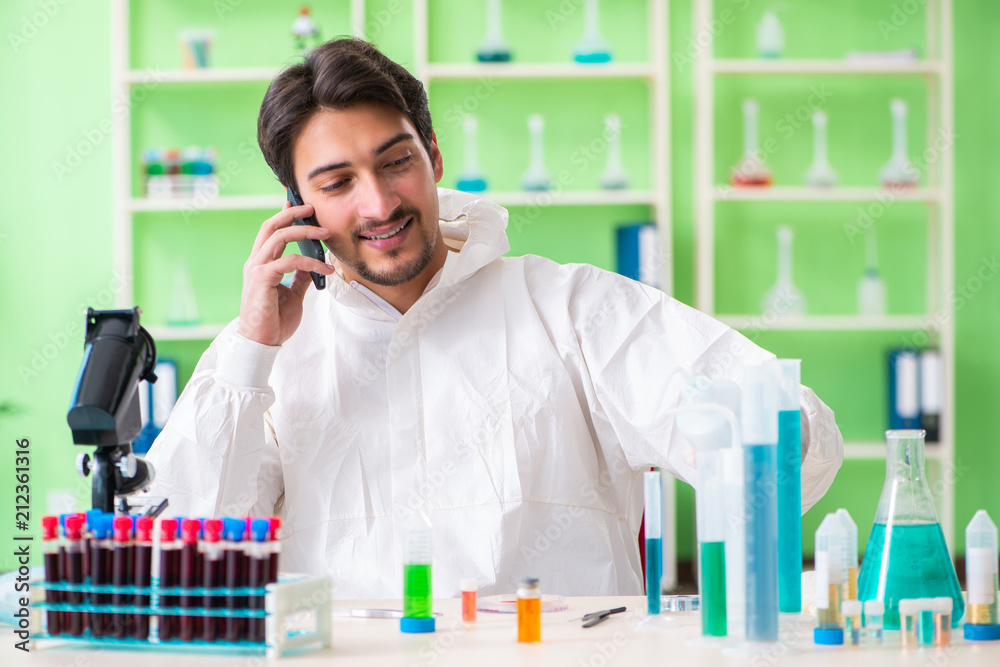 Chemist working in the lab on new experiment Chemist working in the lab on new experiment