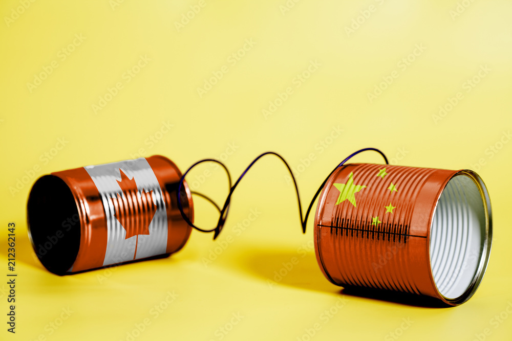 tin can phone with China and Canada Flag .communication concept tin can phone with China and Canada Flag .communication concept