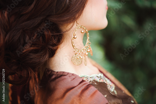 Woman Hands with black mehndi tattoo. Hands of Indian bride girl with black henna tattoos. Fashion. India