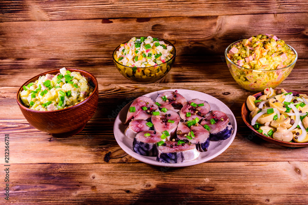 Different festive dishes on a wooden table Different festive dishes on a wooden table