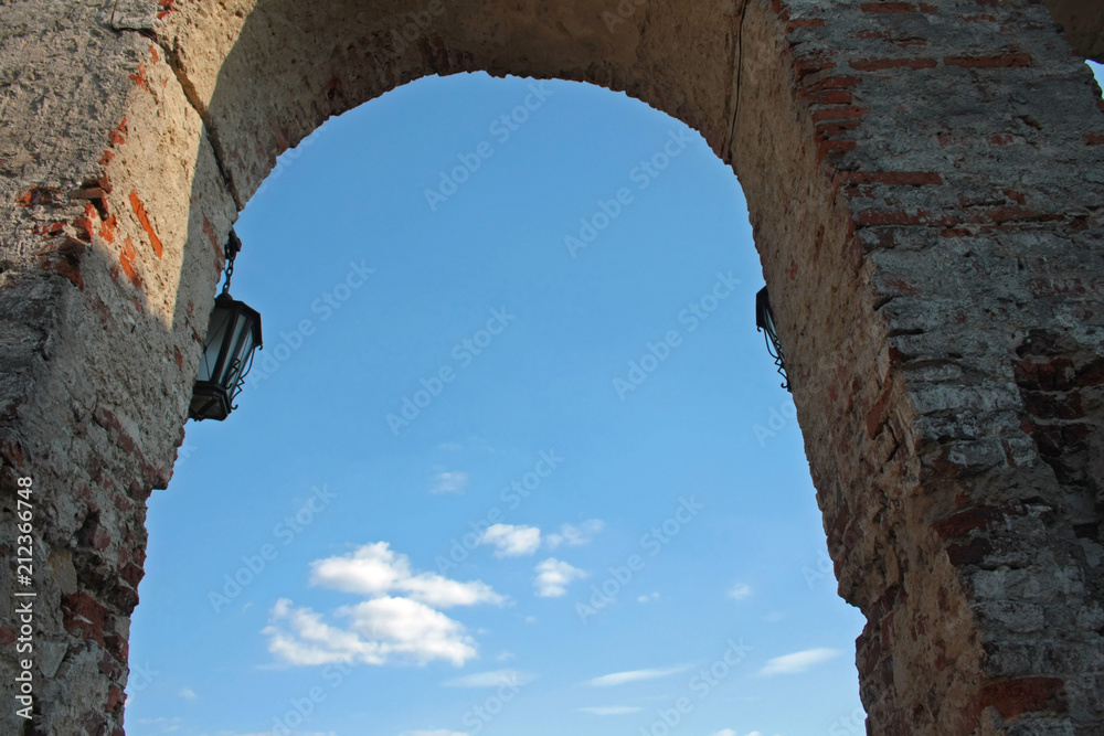 Blue sky in the window of an old castle
