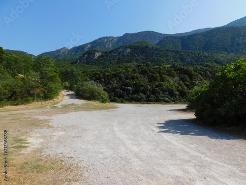 Thermopylae, view of the battlefield of the famous 480 BC battle. The Kolonos hill where the Greeks made their last stand. The sign translates to 