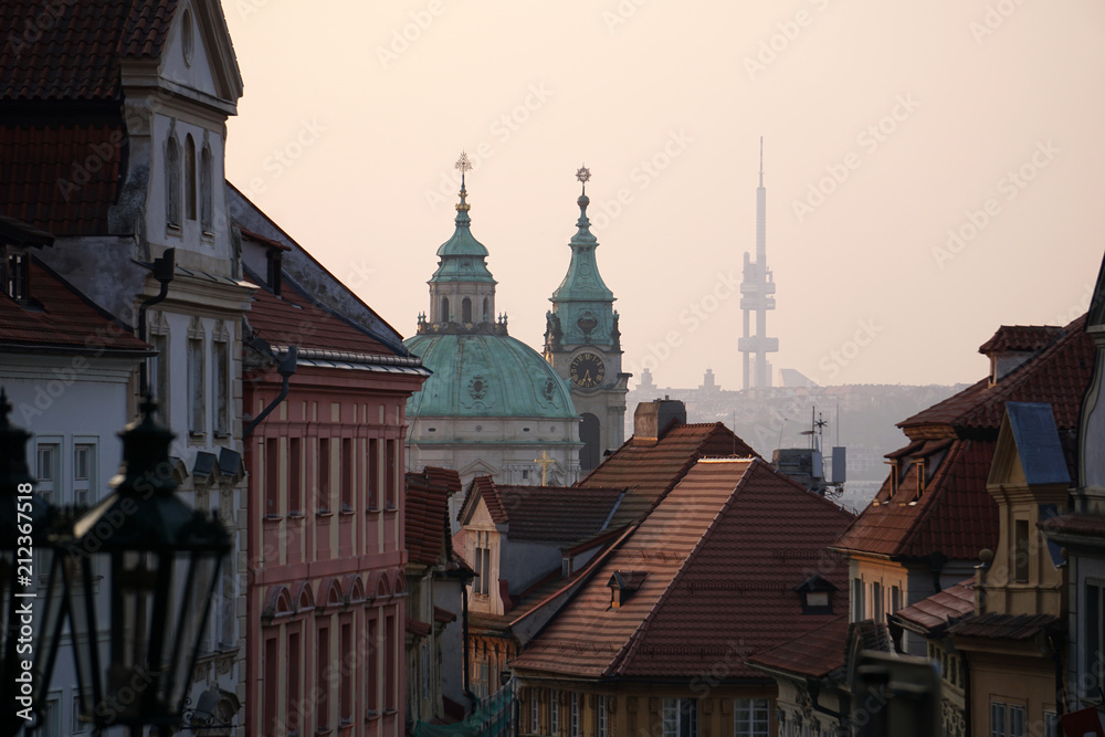 View of the streets of Prague (Nerudova Street) and the church of Saint Nicholas at dawn, horizontal image, Prague, Czech Republic
