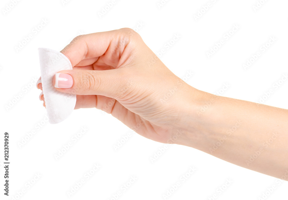 Wadded cotton pads in a hand on a white background isolation Wadded cotton pads in a hand on a white background isolation