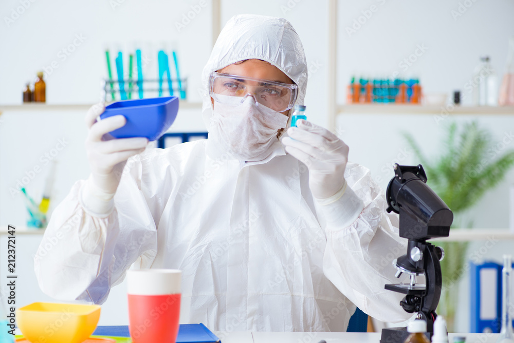 Chemist checking and testing plastic dishes Chemist checking and testing plastic dishes
