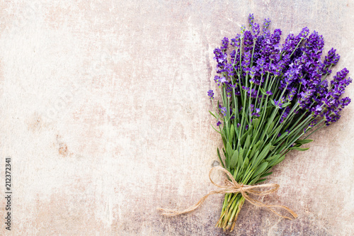 Fototapeta Naklejka Na Ścianę i Meble -  Lavender flowers, bouquet on rustic background, overhead.