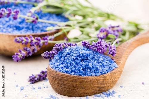 Fototapeta Naklejka Na Ścianę i Meble -  Essential lavender salt with flowers top view.