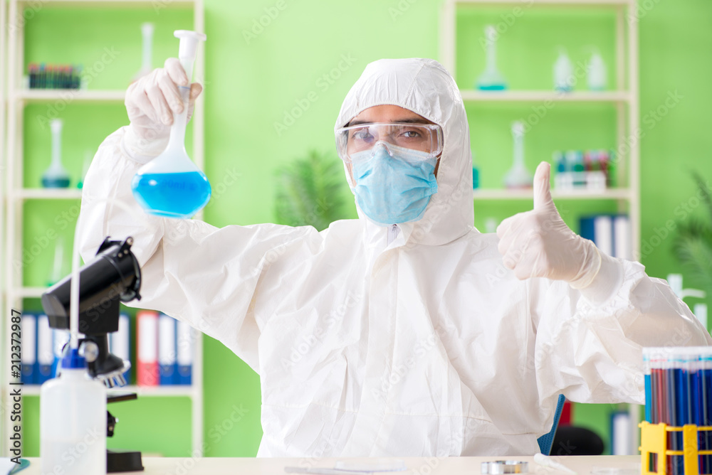 Chemist working in the lab on new experiment Chemist working in the lab on new experiment