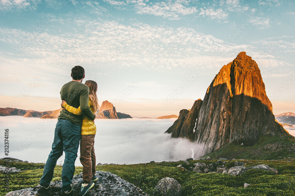 Couple hugging enjoying mountains landscape family traveling together healthy lifestyle concept summer vacations outdoor hiking in Norway