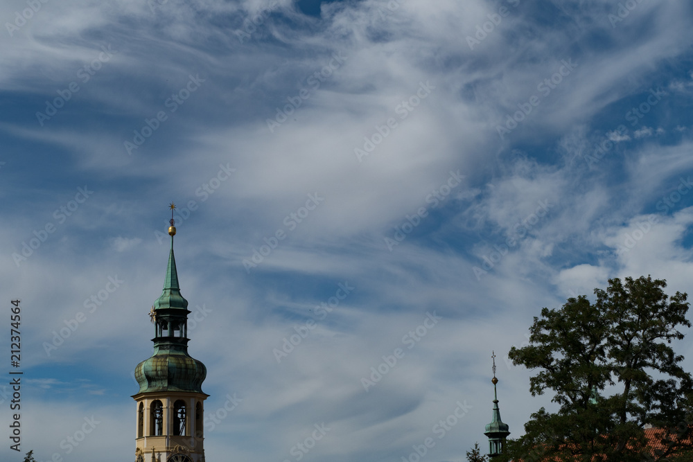 church tower with a blue sky with white clouds