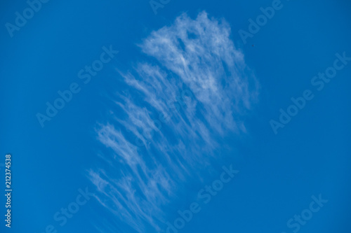 clear blue sky with some white clouds