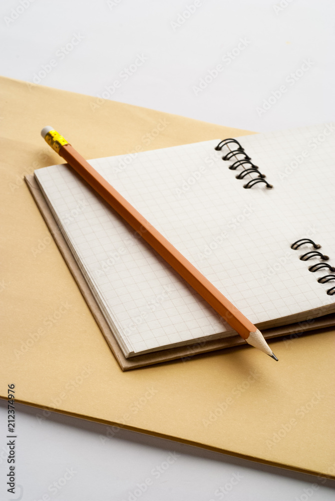 open notebook with pencil on white background office open notebook with pencil on white background office