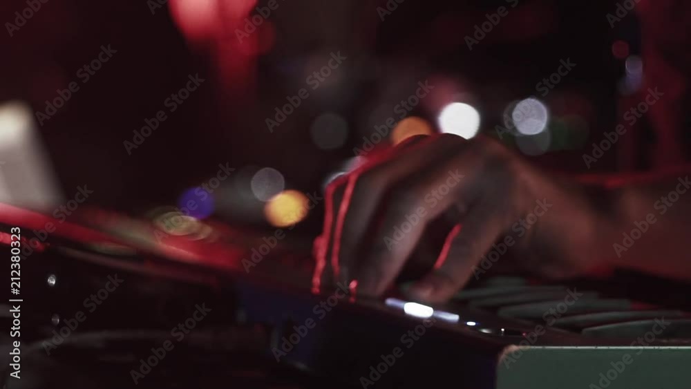 Dj mixer equipment to control sound and play music in red lights. Dj mixer equipment to control sound and play music in red lights.