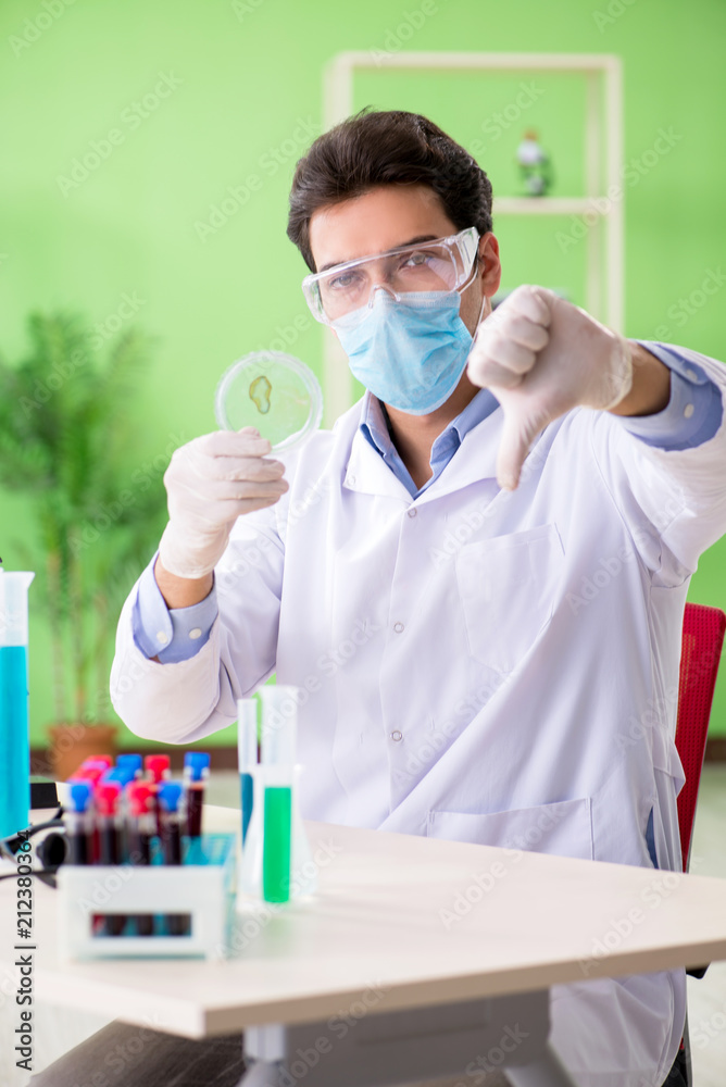 Man chemist working in the lab Man chemist working in the lab