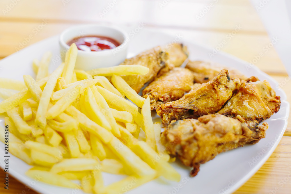 Fried chicken with french fries on the table Fried chicken with french fries on the table