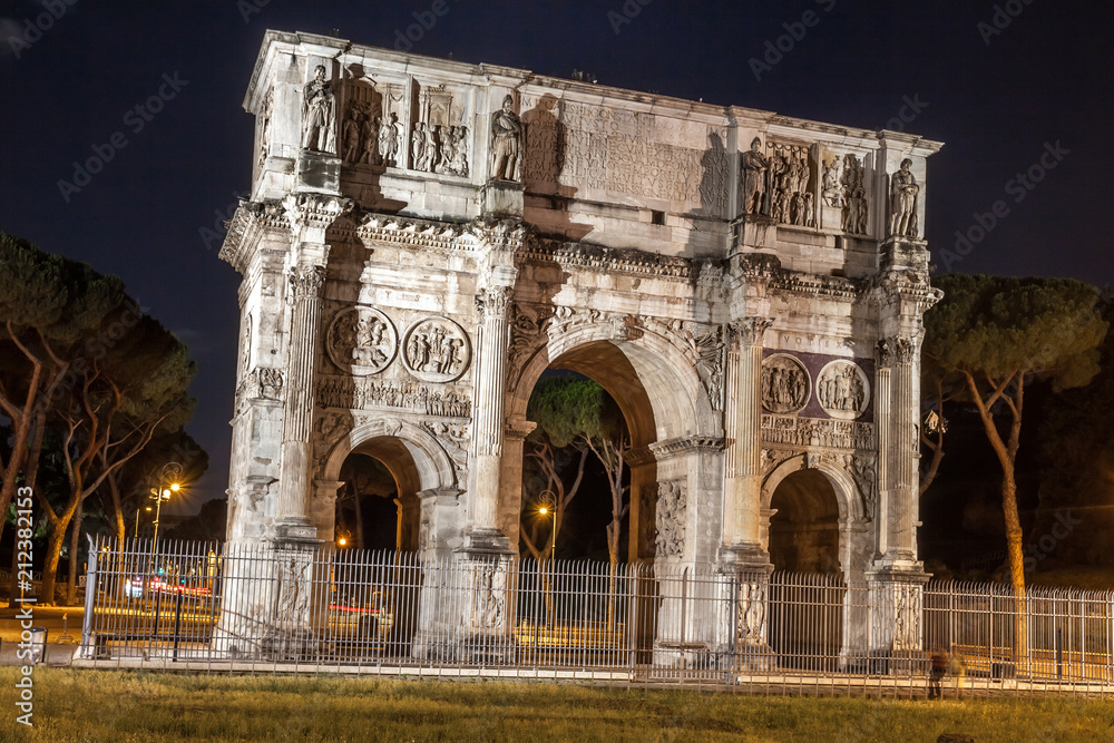 Antique arch of Constantine in Rome at night, Italy