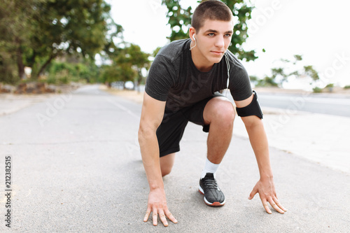 A young man makes a morning jog in the streets, sports training
