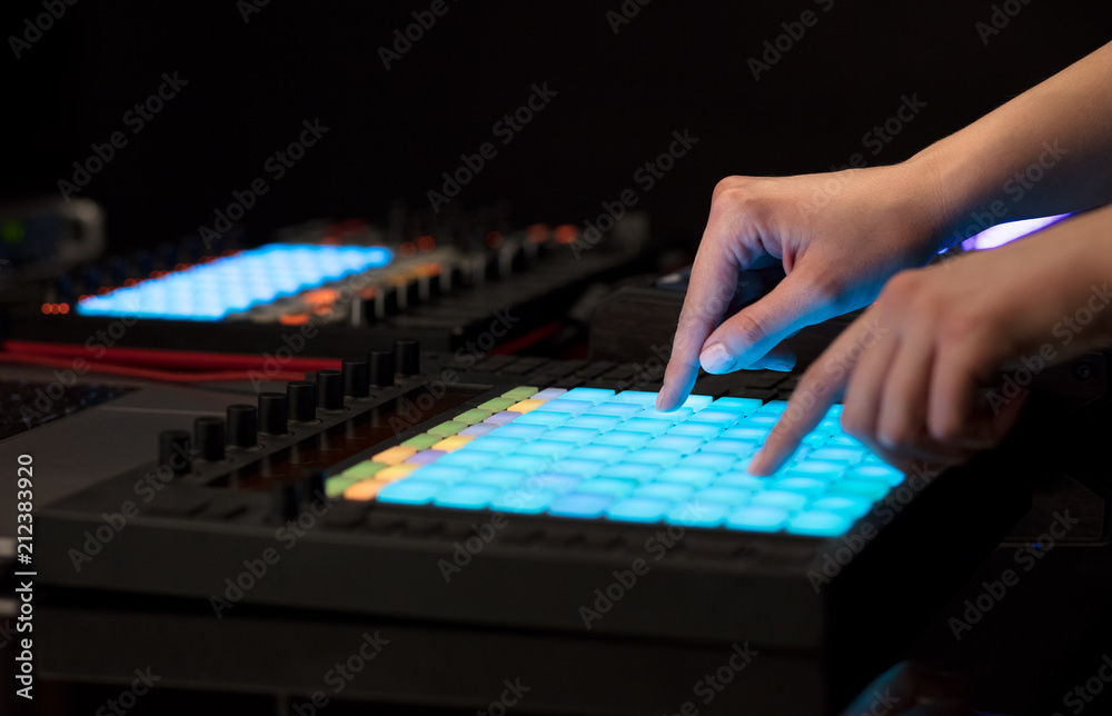 Fototapeta premium Dj hand remixing music on midi controller