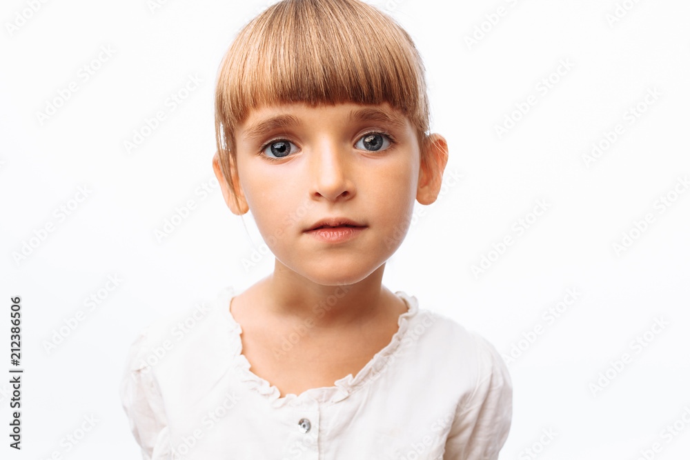 Portrait of a beautiful little girl, on a white background in the Studio, posing Portrait of a beautiful little girl, on a white background in the Studio, posing