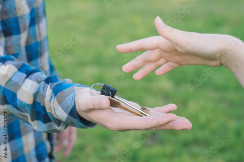 Woman returning keys from house to the man
