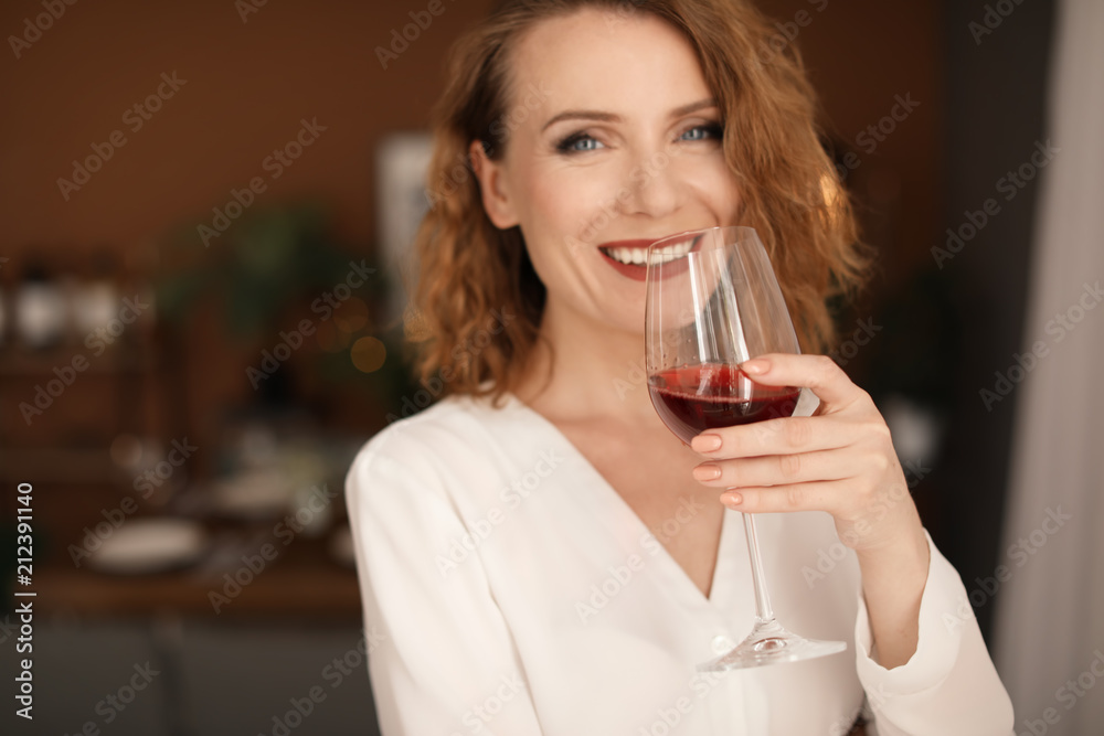 Woman with glass of delicious wine indoors Woman with glass of delicious wine indoors