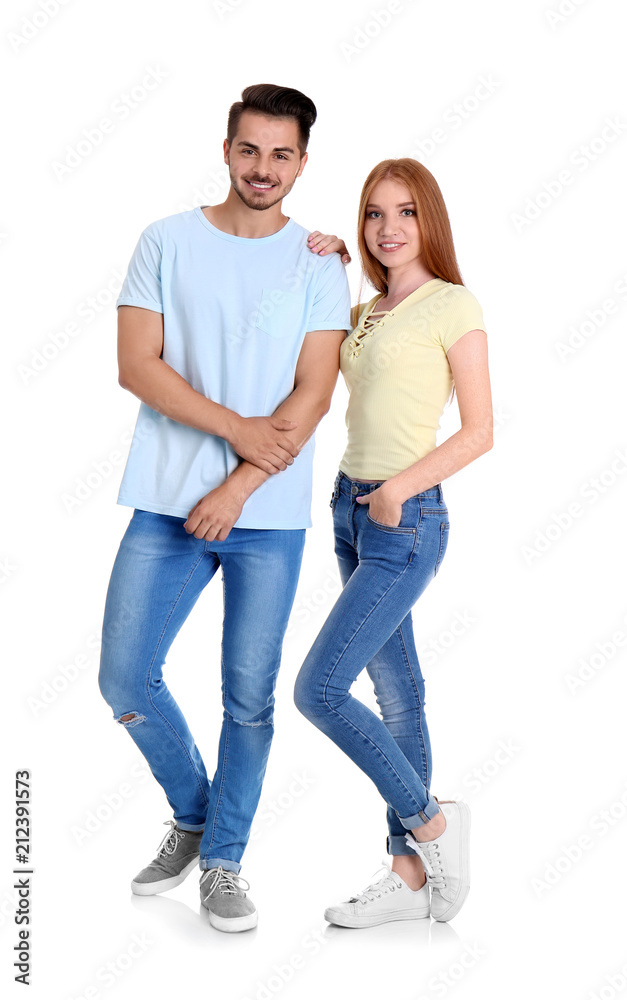 Young couple in stylish jeans on white background Young couple in stylish jeans on white background