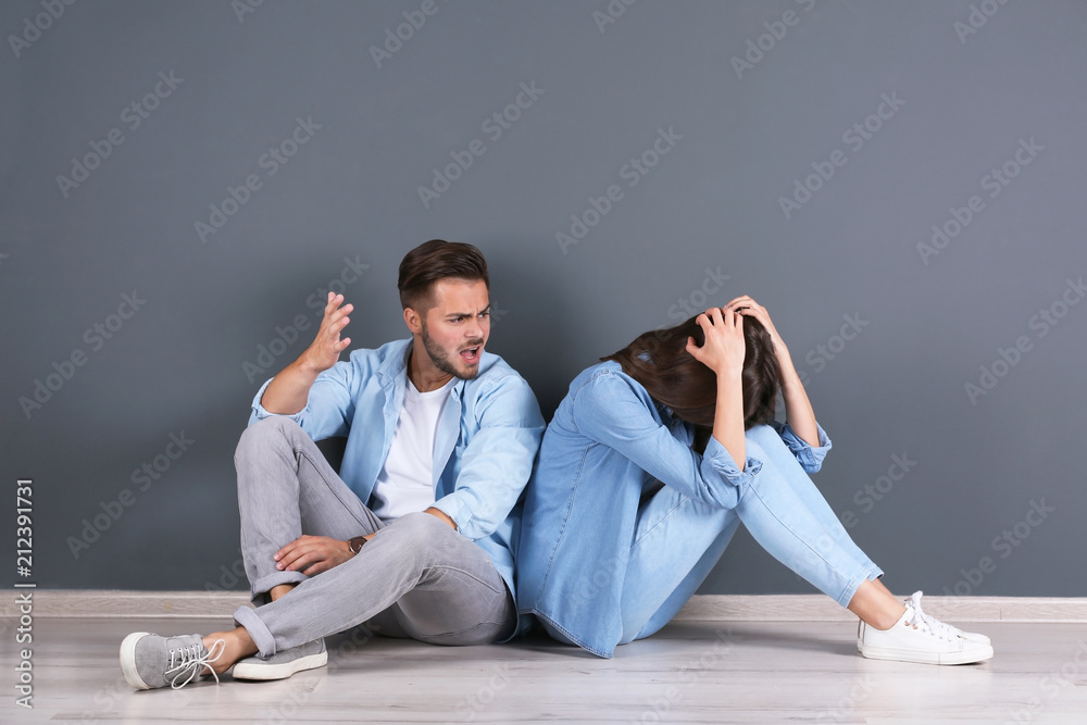 Fototapeta premium Young couple having argument indoors. Relationship problems