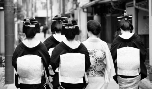 Traditional geisha and maiko out and about walking in Gion Kyoto Japan. 