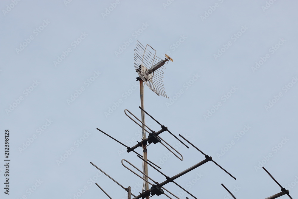 tv antenna above roof at home , receiver communication data with blue sky tv antenna above roof at home , receiver communication data with blue sky