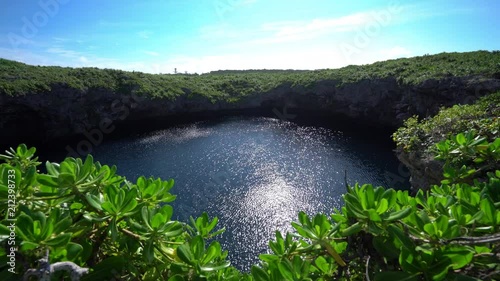 Okinawa,Japan-July 7, 2018: Tori ike is a blue hole at Shimoji island. It consists of two lakes. The color changes due to thermocline. photo